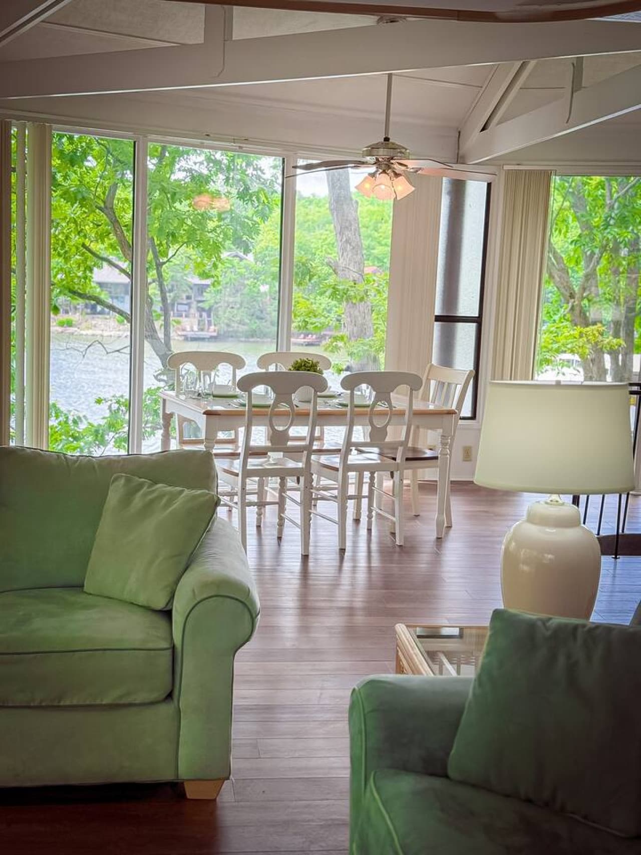 Unwind in the spacious living area, where large windows offer captivating lake views, creating a seamless connection with nature.