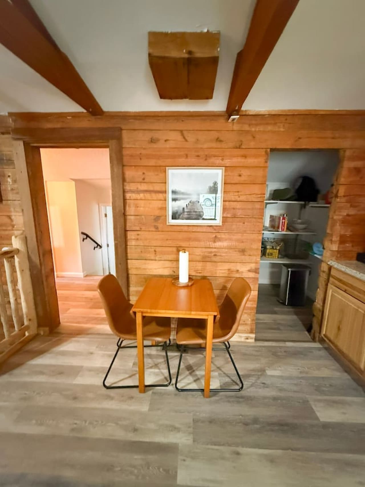 Simple wooden table set for two, perfect for morning coffee or intimate meals.