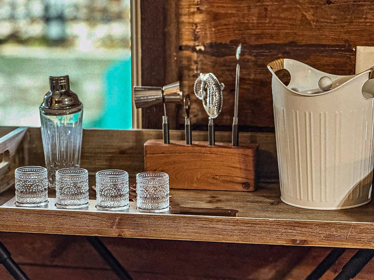 Enjoy cocktails with provided bar tools and glasses.