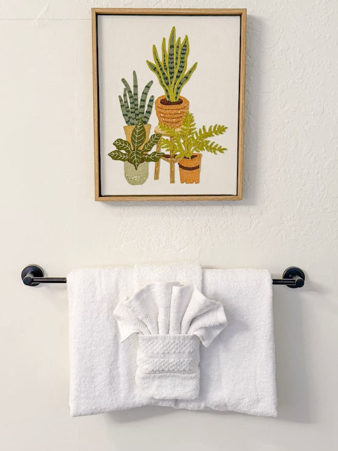 Simple, clean bathroom with cozy details.