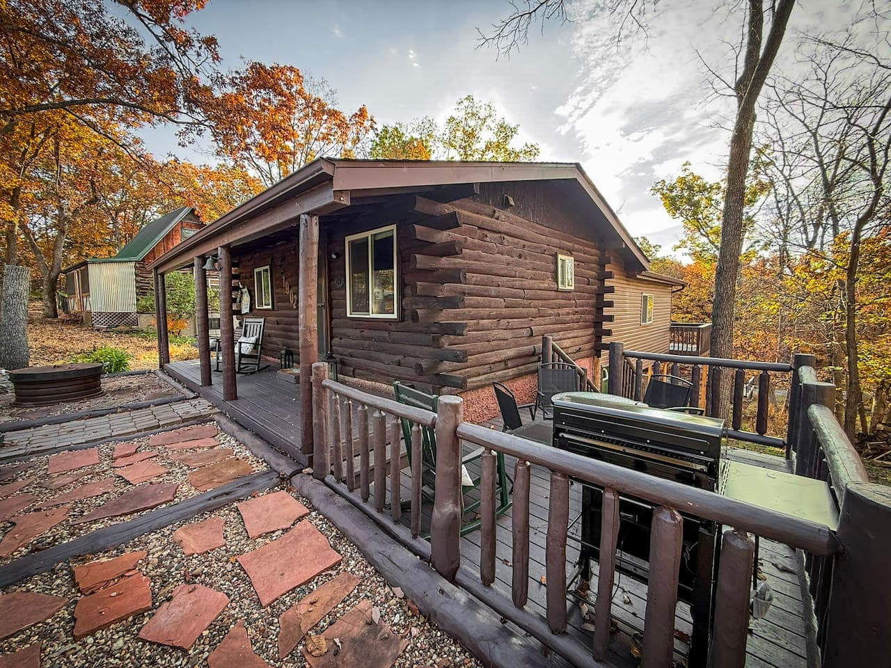 Classic log cabin surrounded by nature.