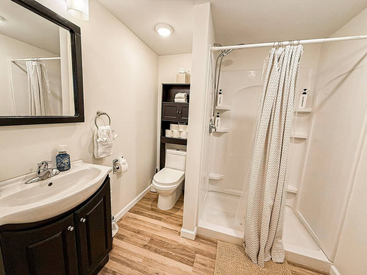 Modern shower, vanity, and fresh essentials.