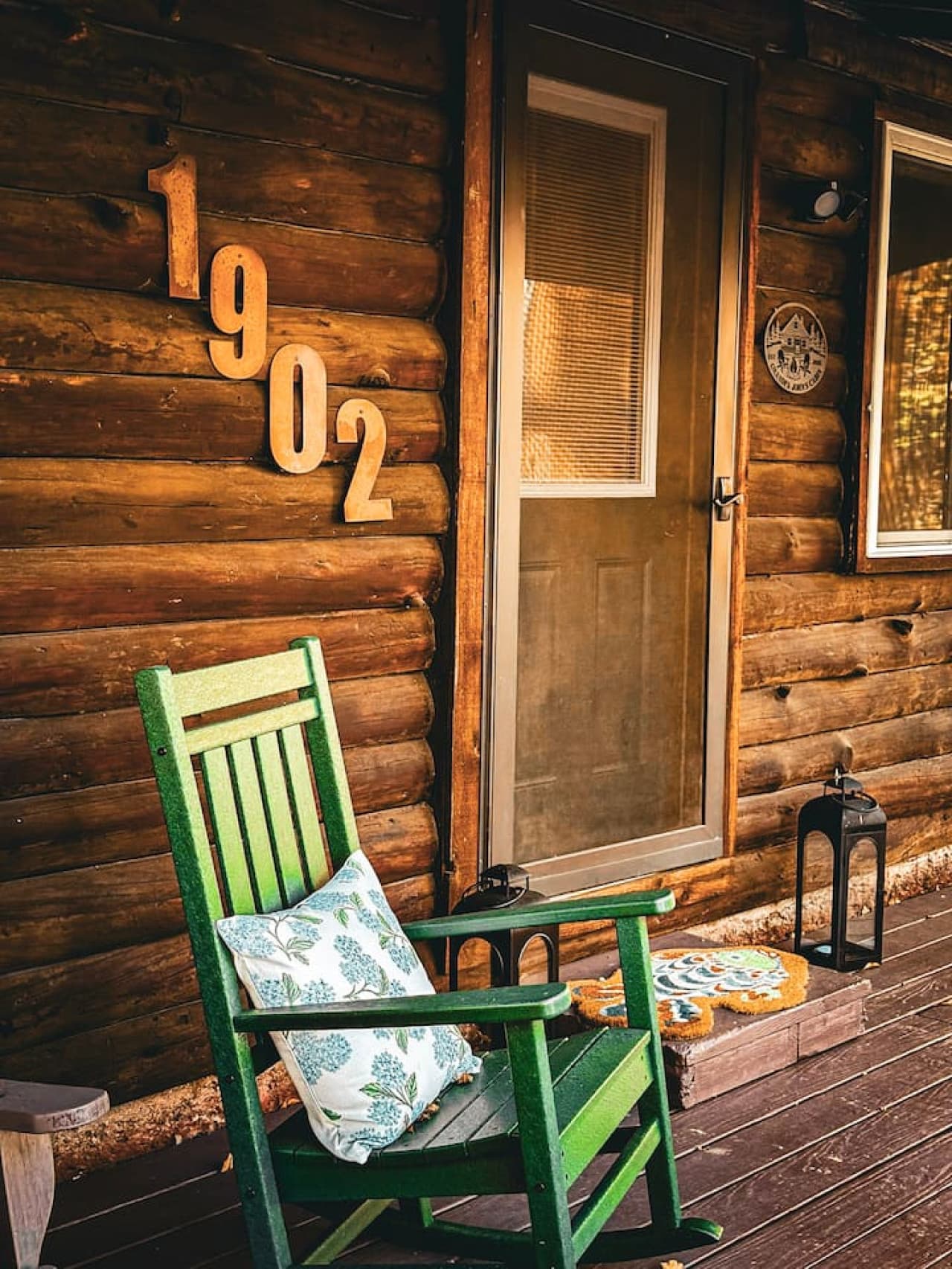 Charming front entry with a cozy rocker.