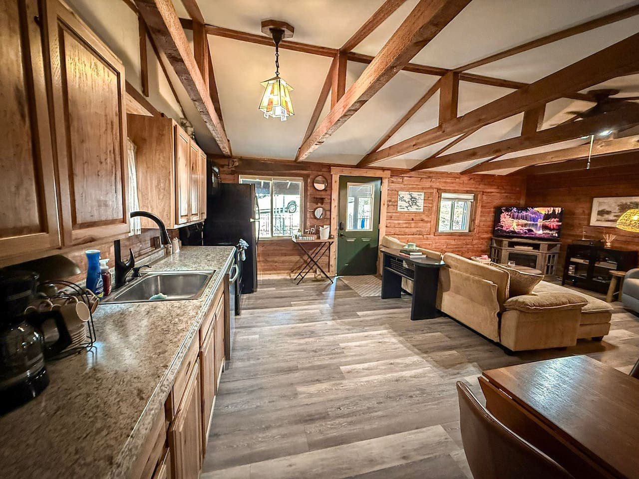 Spacious cabin interior with warm wood tones.