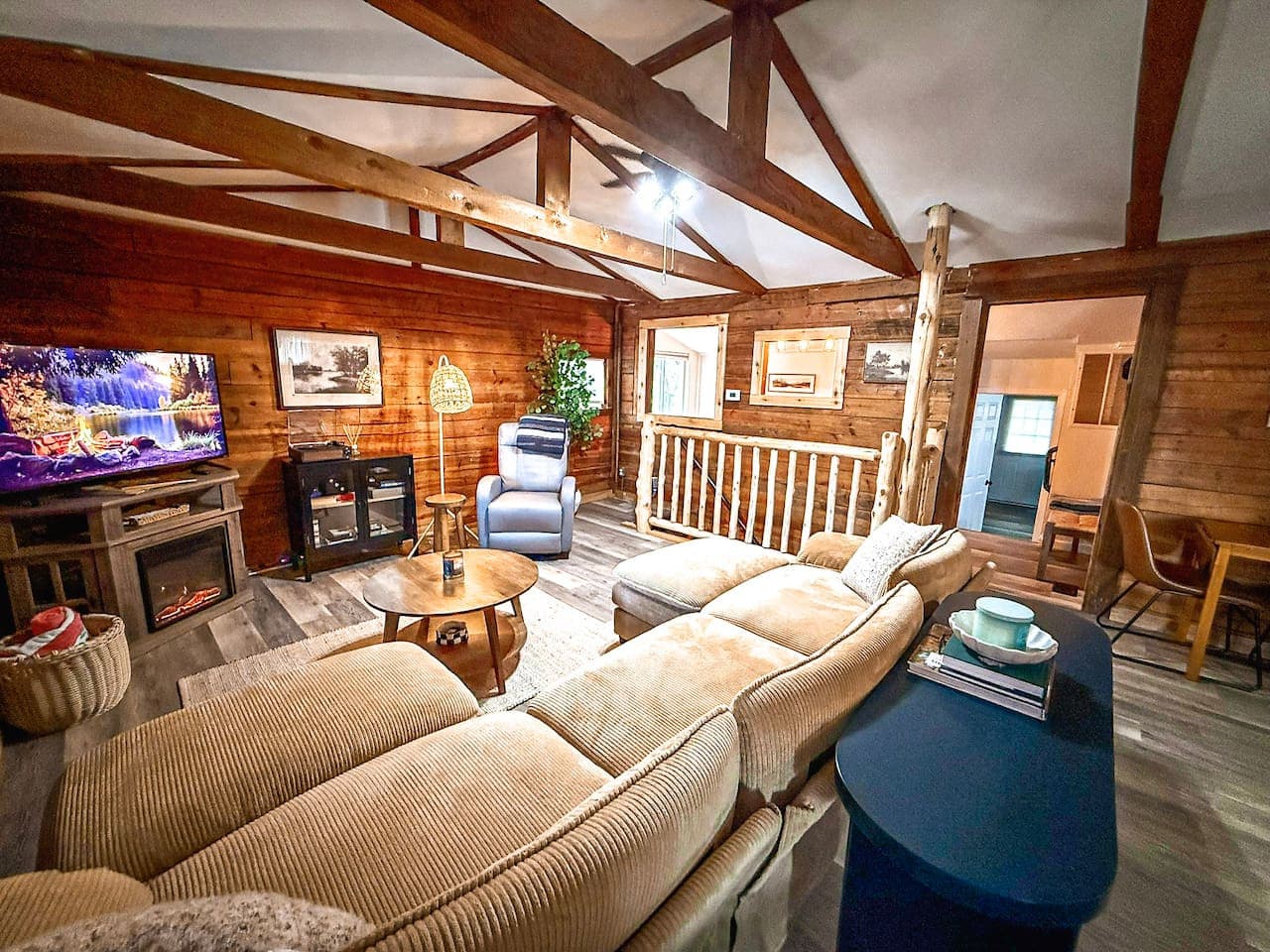 Spacious sectional and cozy fireplace.