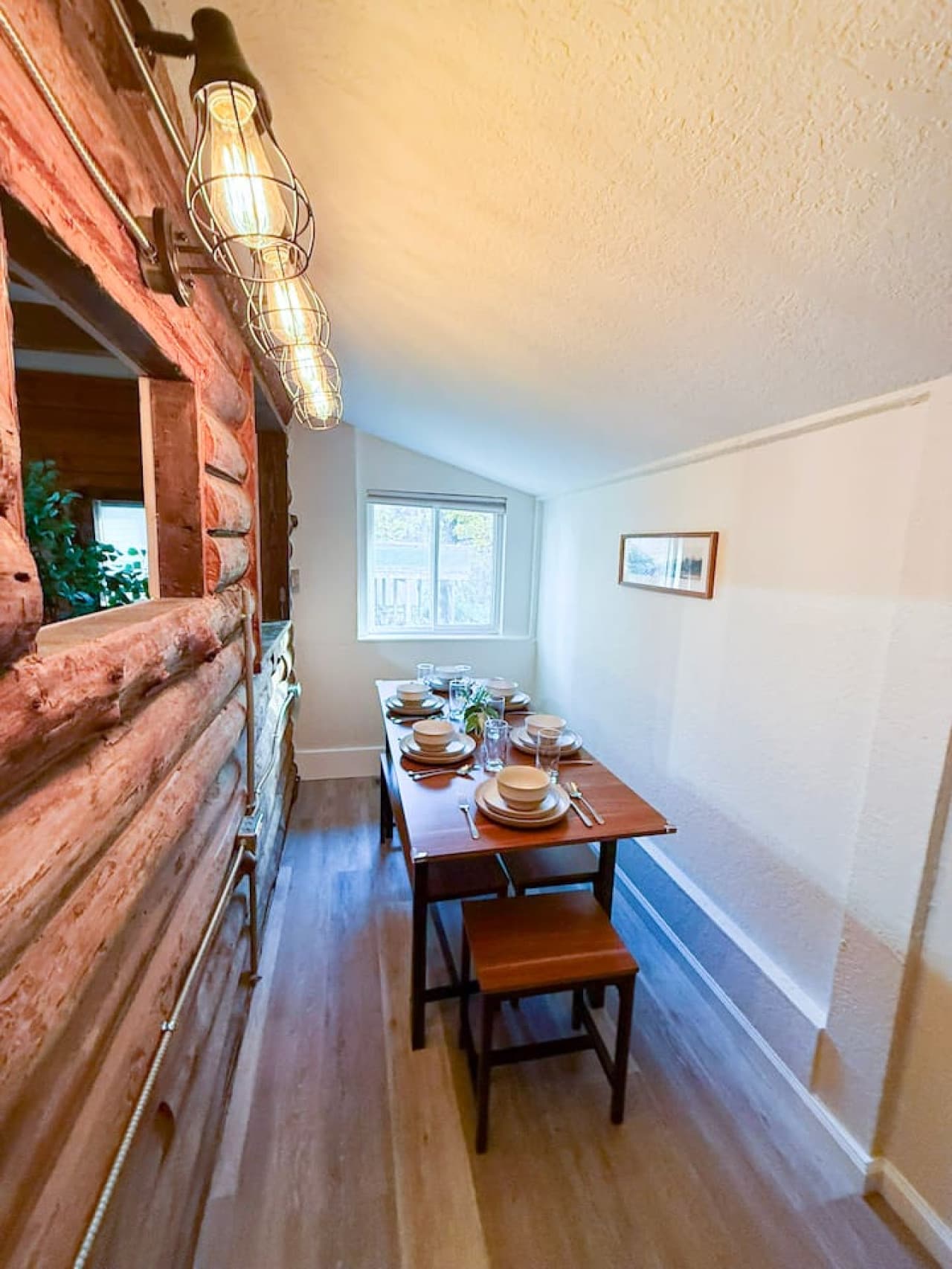 Charming table with warm cabin lighting.