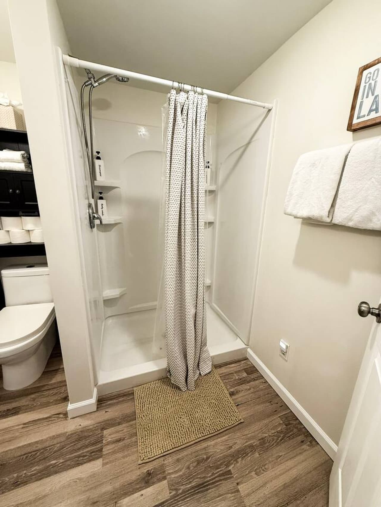 Modern shower and fresh towels provided.