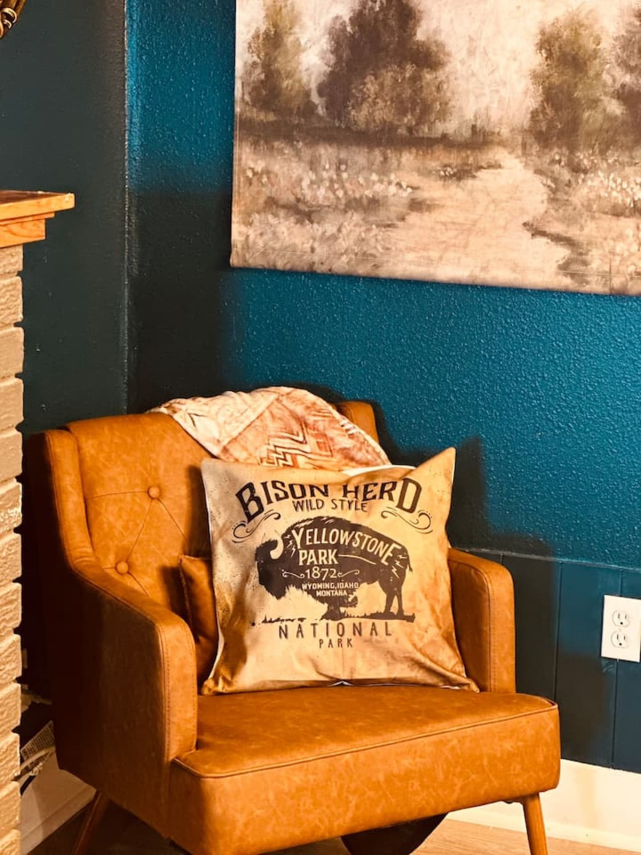 A vintage-style leather armchair, complete with Yellowstone-inspired décor, invites you to kick back and unwind.