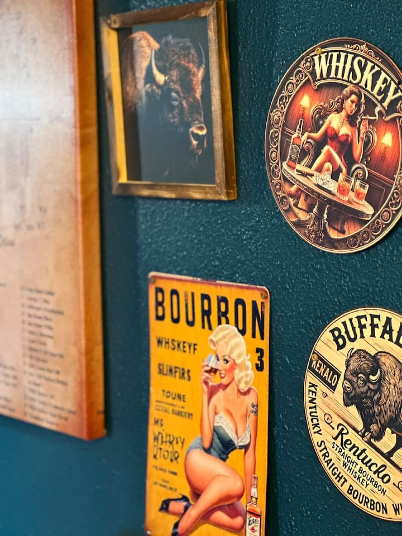Vintage-style bourbon signs meet buffalo art for a one-of-a-kind aesthetic.