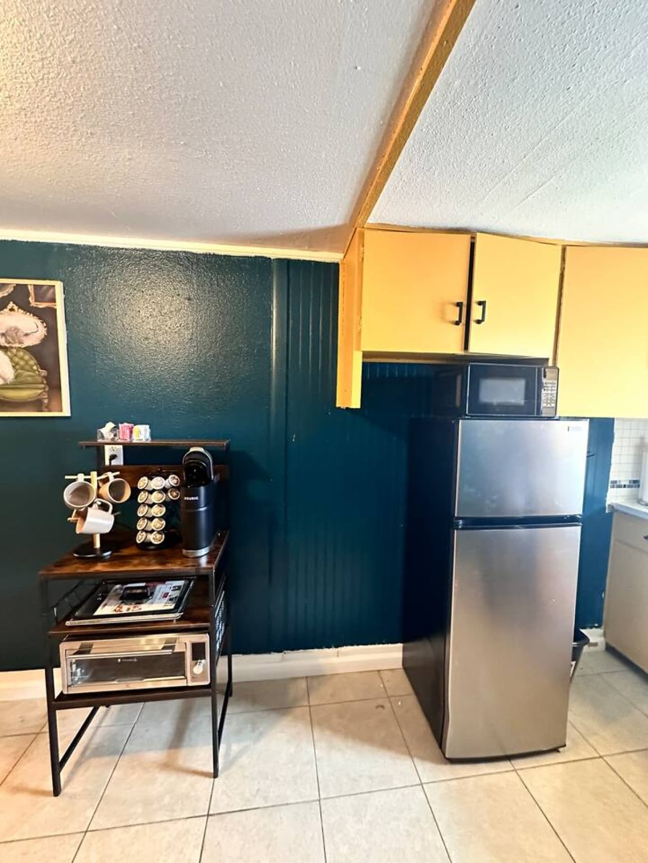 Kitchenette with coffee bar, refrigerator, microwave and airfryer.