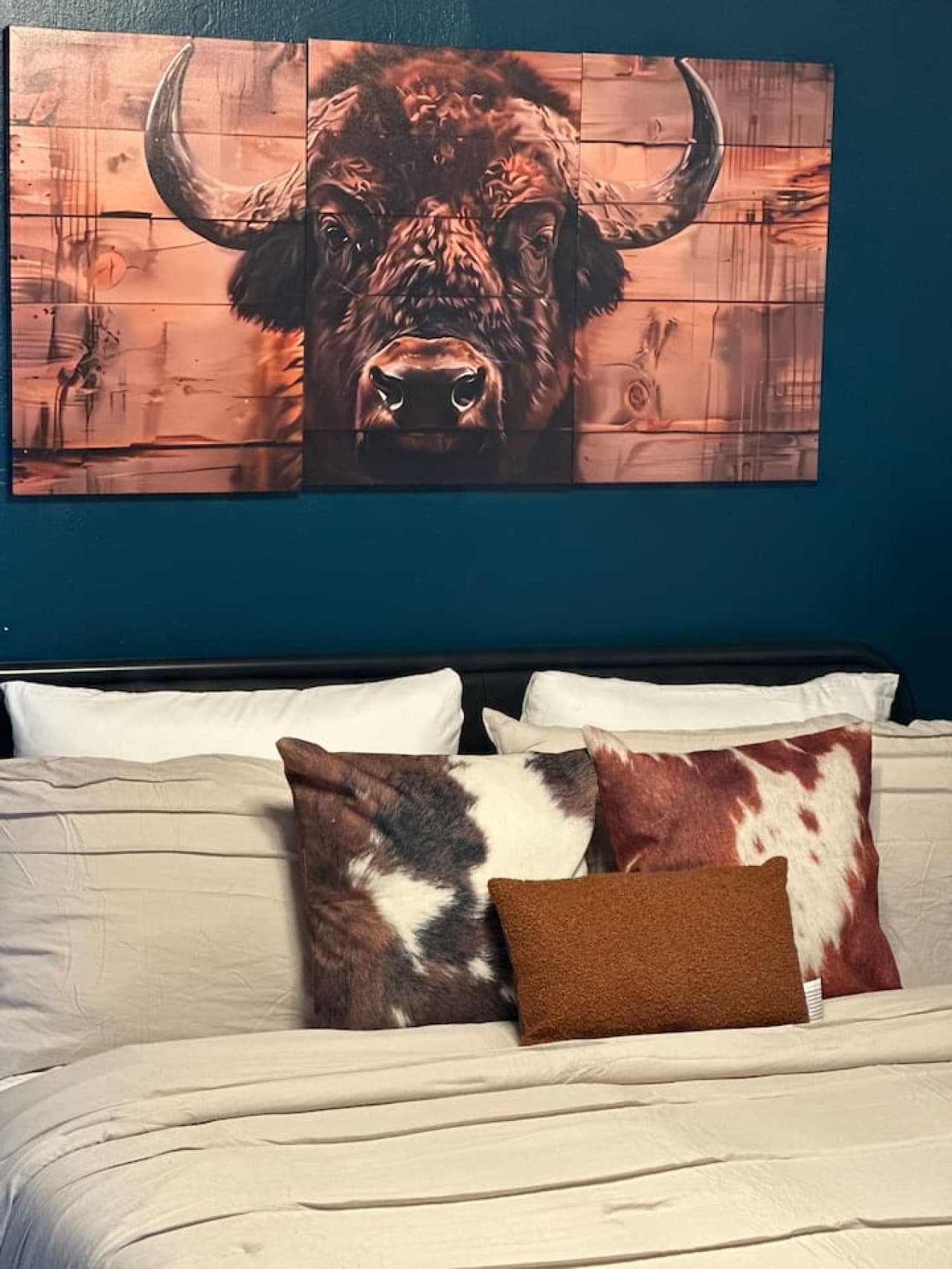 Majestic bison watching over you as you rest. We love this statement piece above the bed in our bungalow.