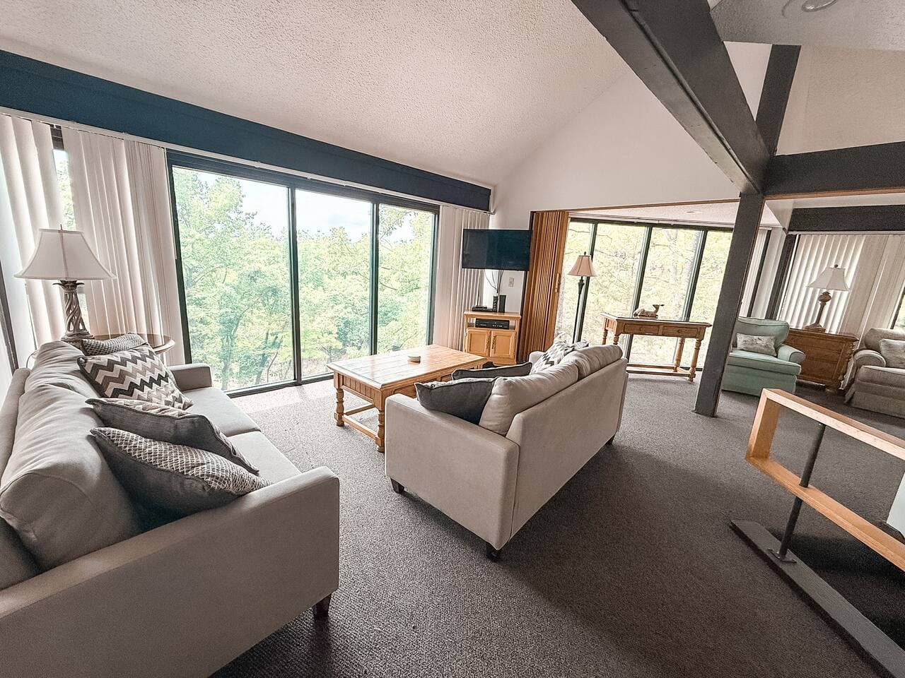 "Our open-concept living area seamlessly connects to the dining and kitchen spaces, making it perfect for entertaining and creating memories."