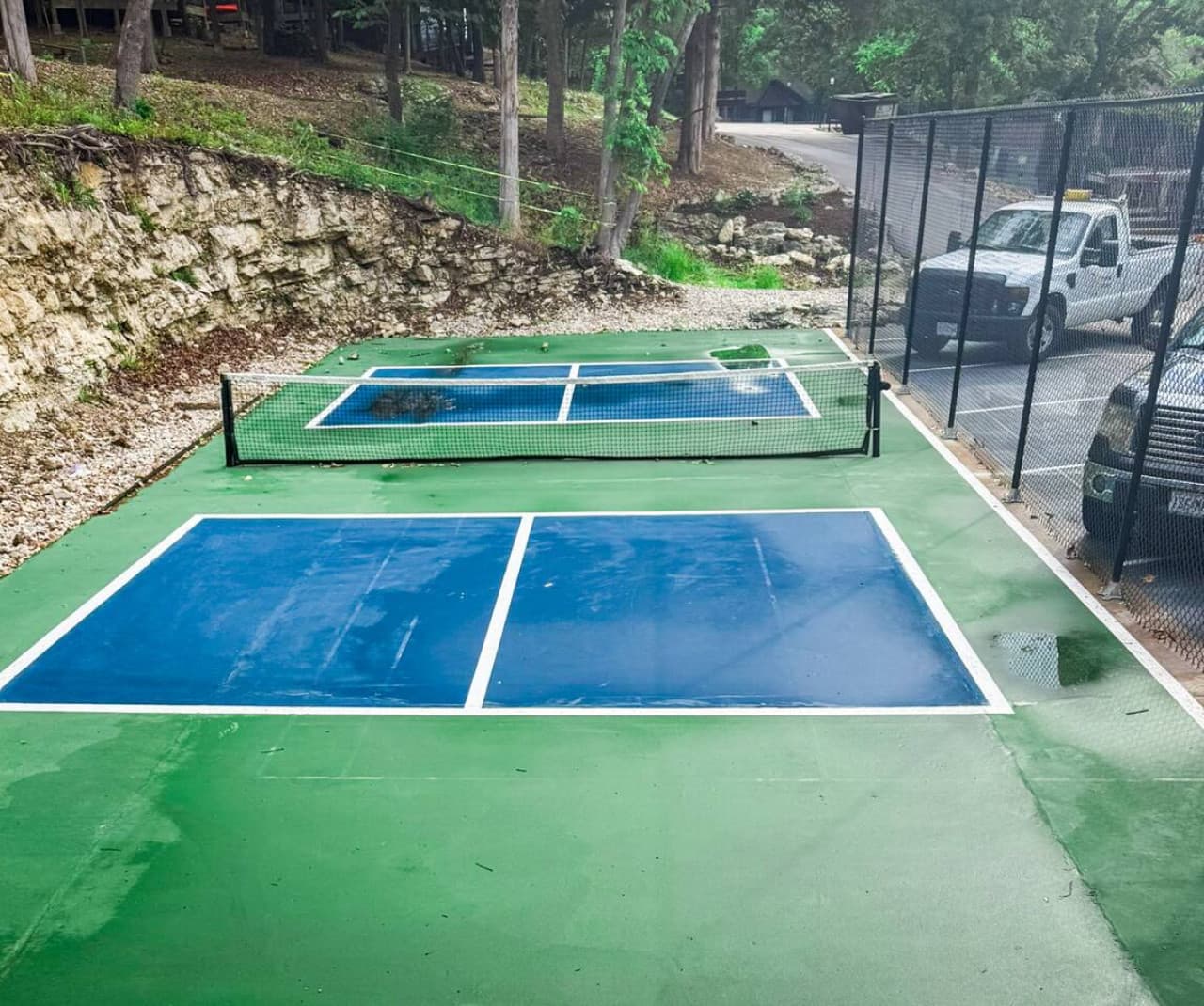 Pickleball court located across from the pool – paddles available to check out at the Treetop office during business hours