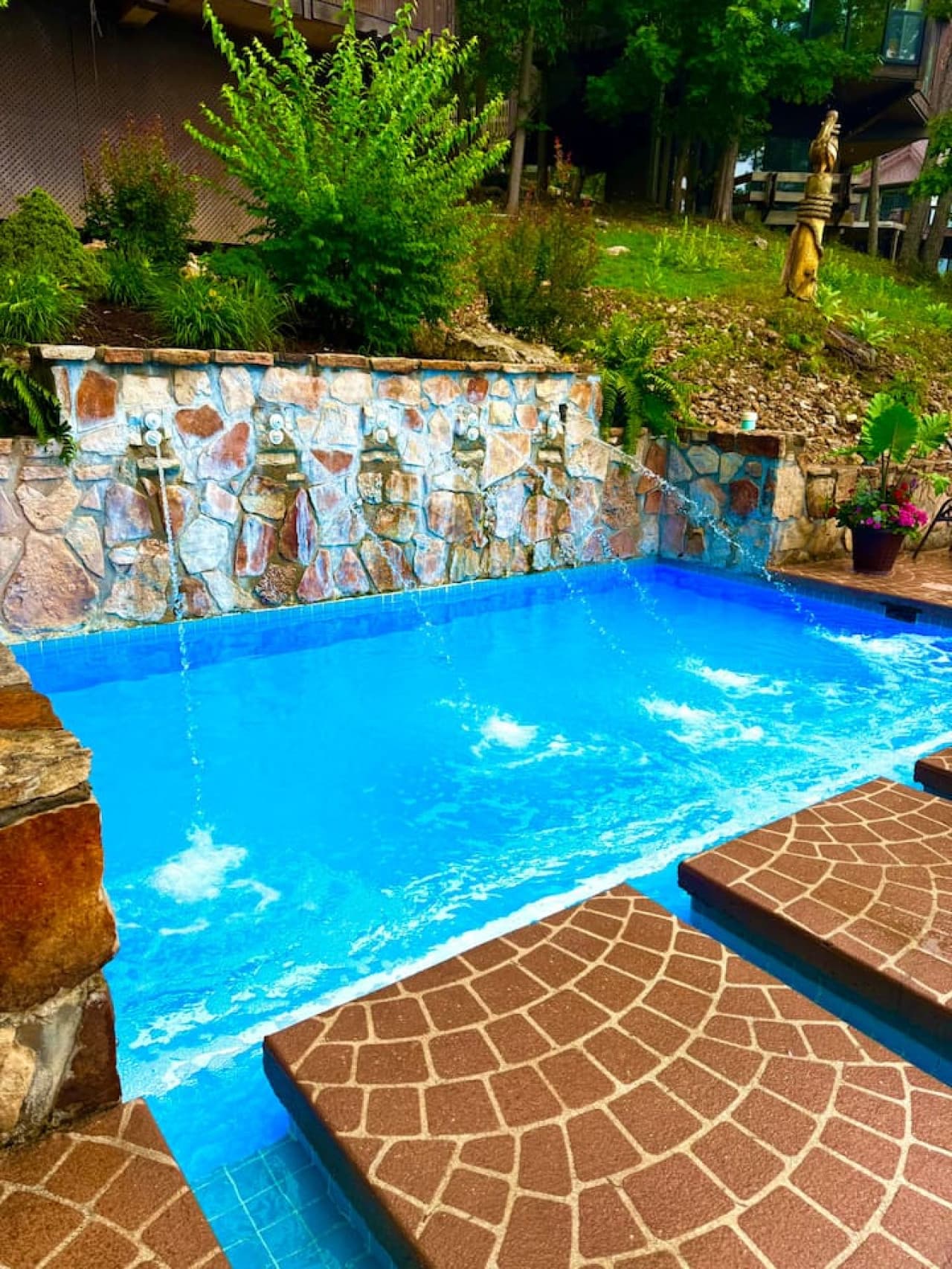 "Dive into relaxation! This beautiful pool features soothing water jets and a unique design, perfect for unwinding under the sun."