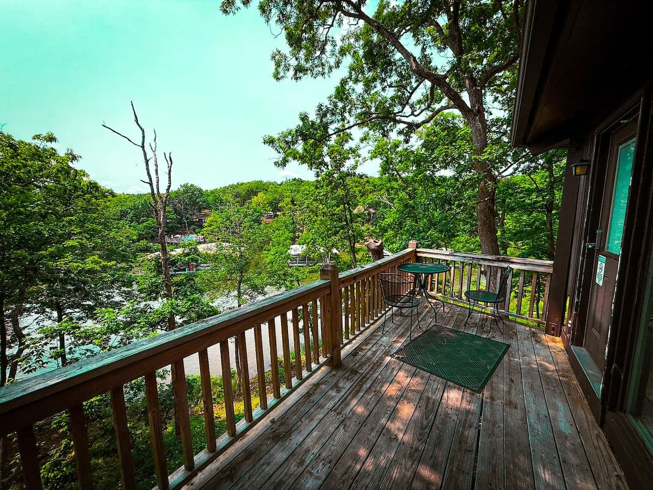 Perched among the branches, The Branch Bungalow deck offers unparalleled views and a breath of fresh air. Your private oasis awaits!