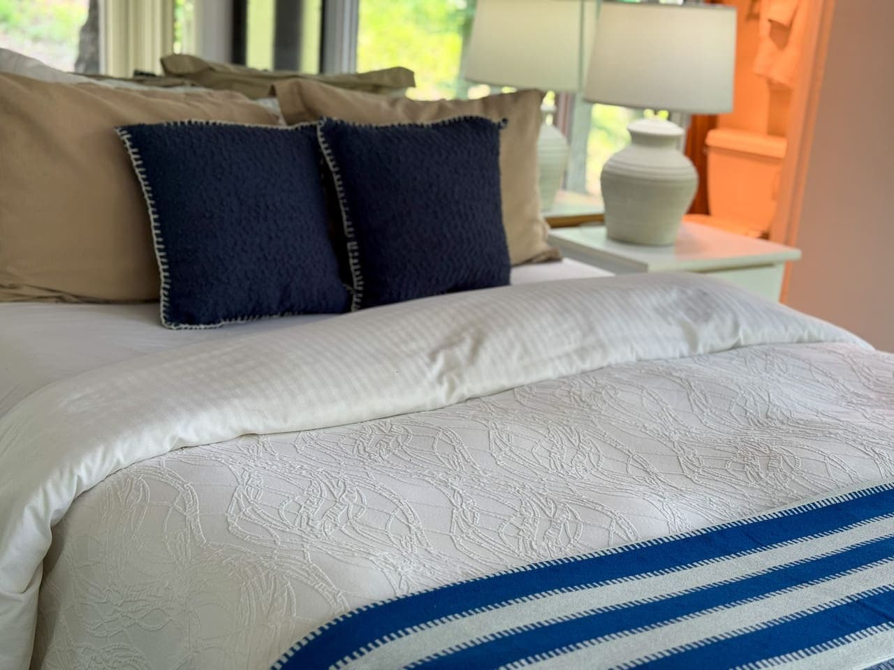 Wake up refreshed in this inviting bedroom, designed for comfort after a day on the lake.