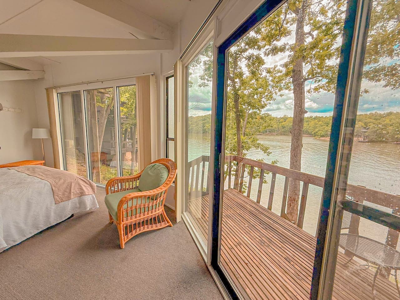 Start your day with peaceful lake views from the comfort of this cozy bedroom  here at Oak & Ember Treetop