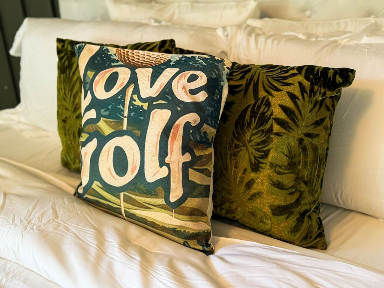The carefully curated throw pillows add a touch of personality and comfort to the bedroom, enhancing its cozy appeal. Their vibrant textures and patterns provide a stylish pop of color, complementing the overall serene aesthetic.