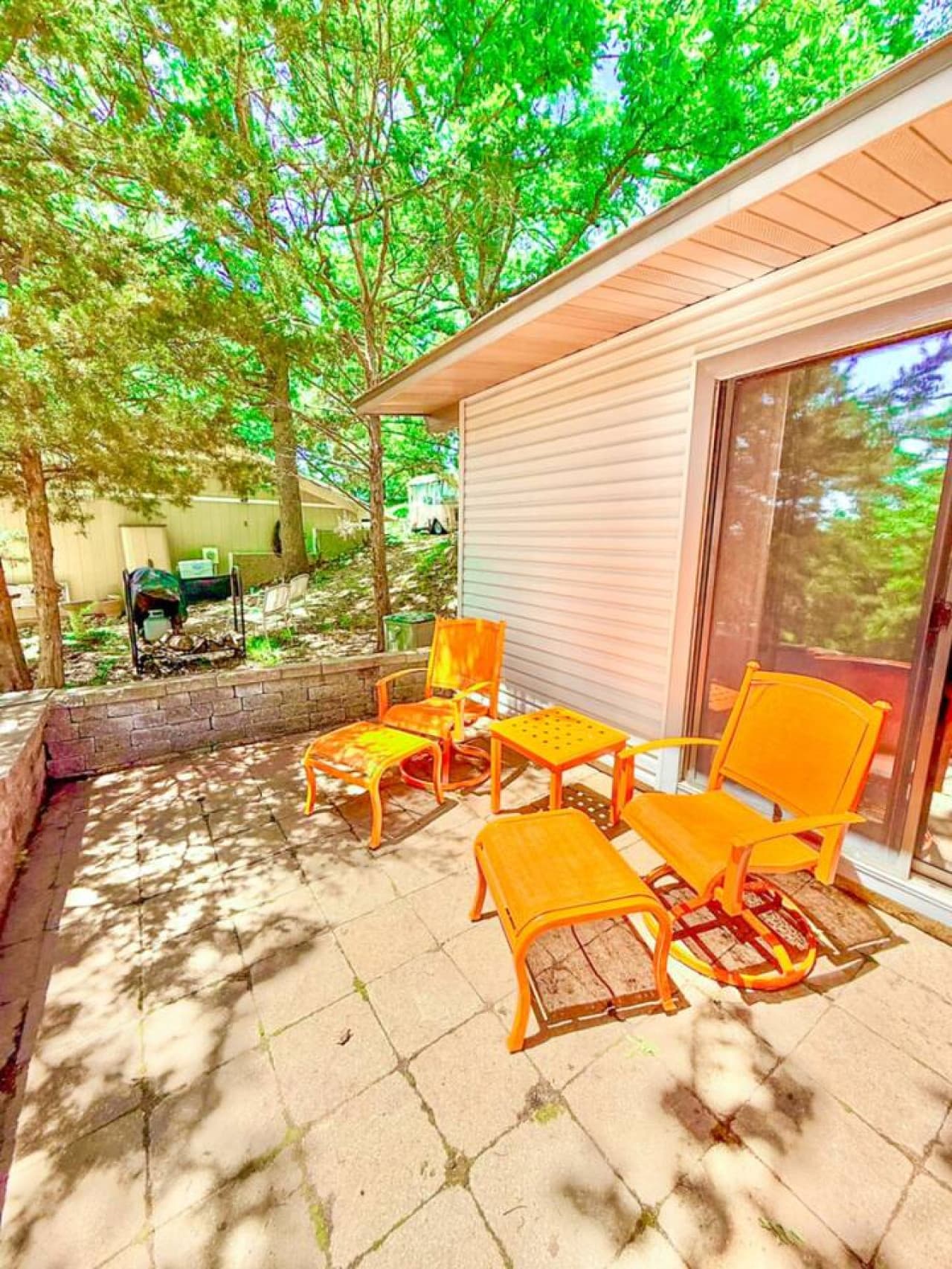 Start your morning or wind down your evening in this cozy outdoor nook under the trees.