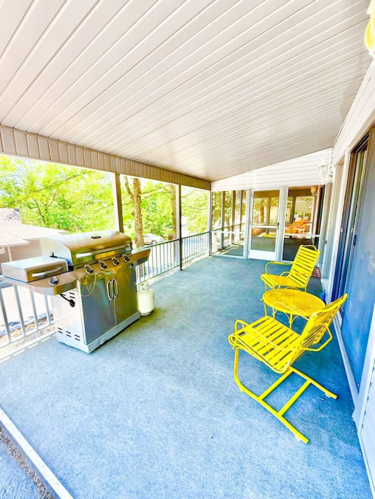 Enjoy laid-back lake vibes on your private covered deck—complete with a full-size grill and cheerful seating for sunset chats or morning coffee.