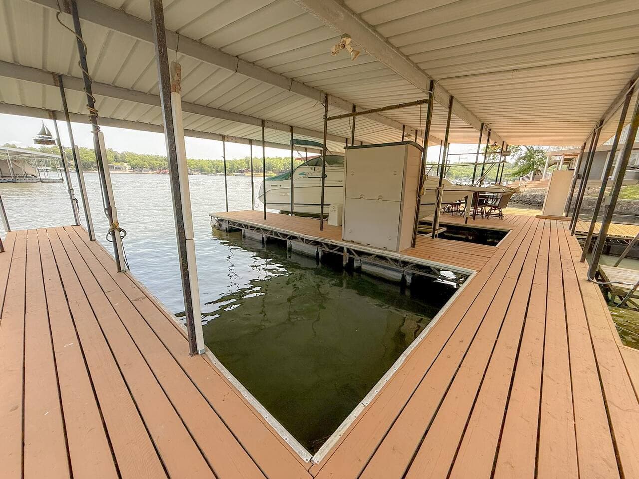 A well-maintained place for a boat slip. A peaceful spot for enjoying the water, whether it’s for boating, fishing, or just relaxing by the lake.