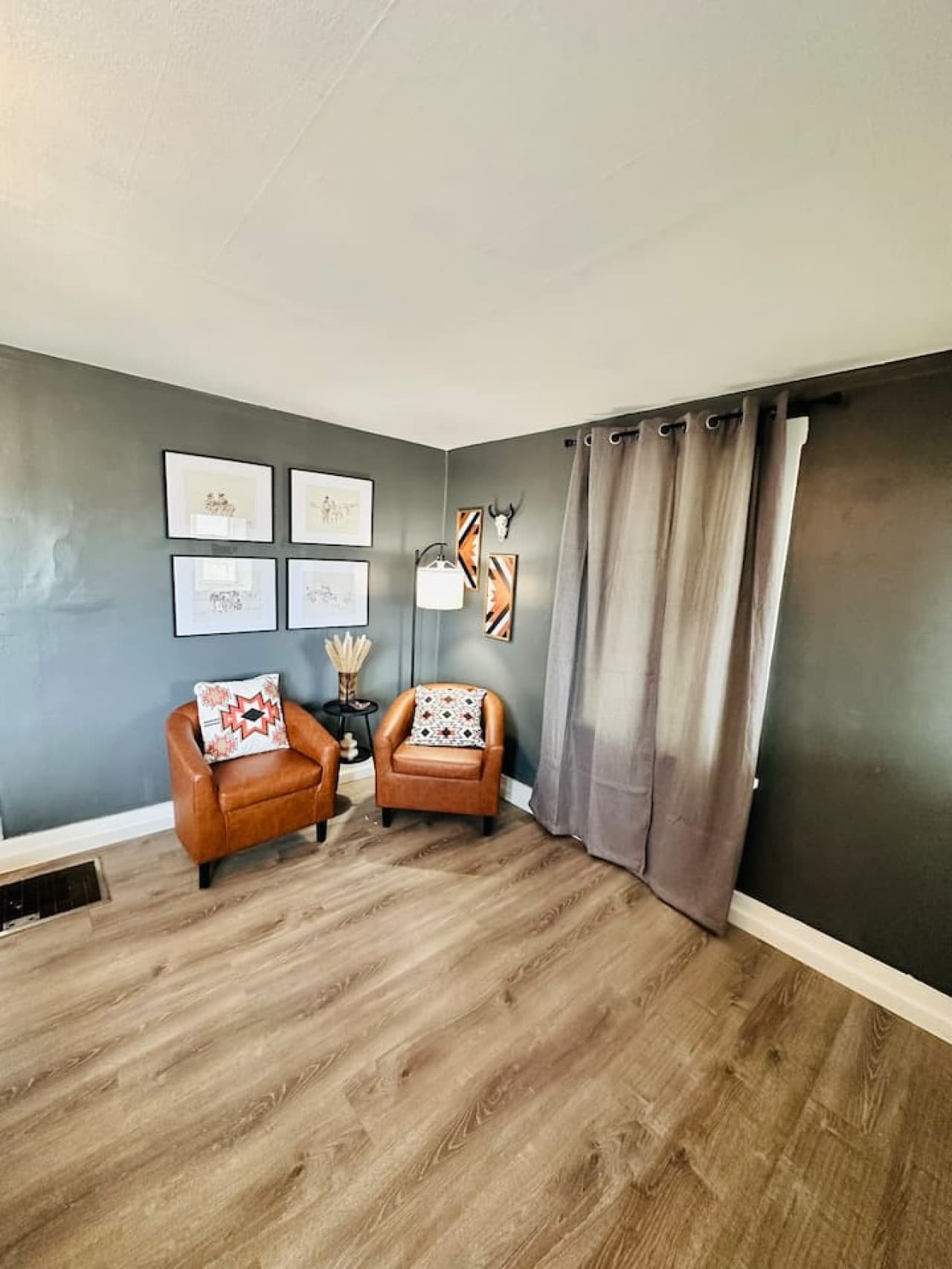 Thoughtfully styled sitting area with natural light and rustic touches.