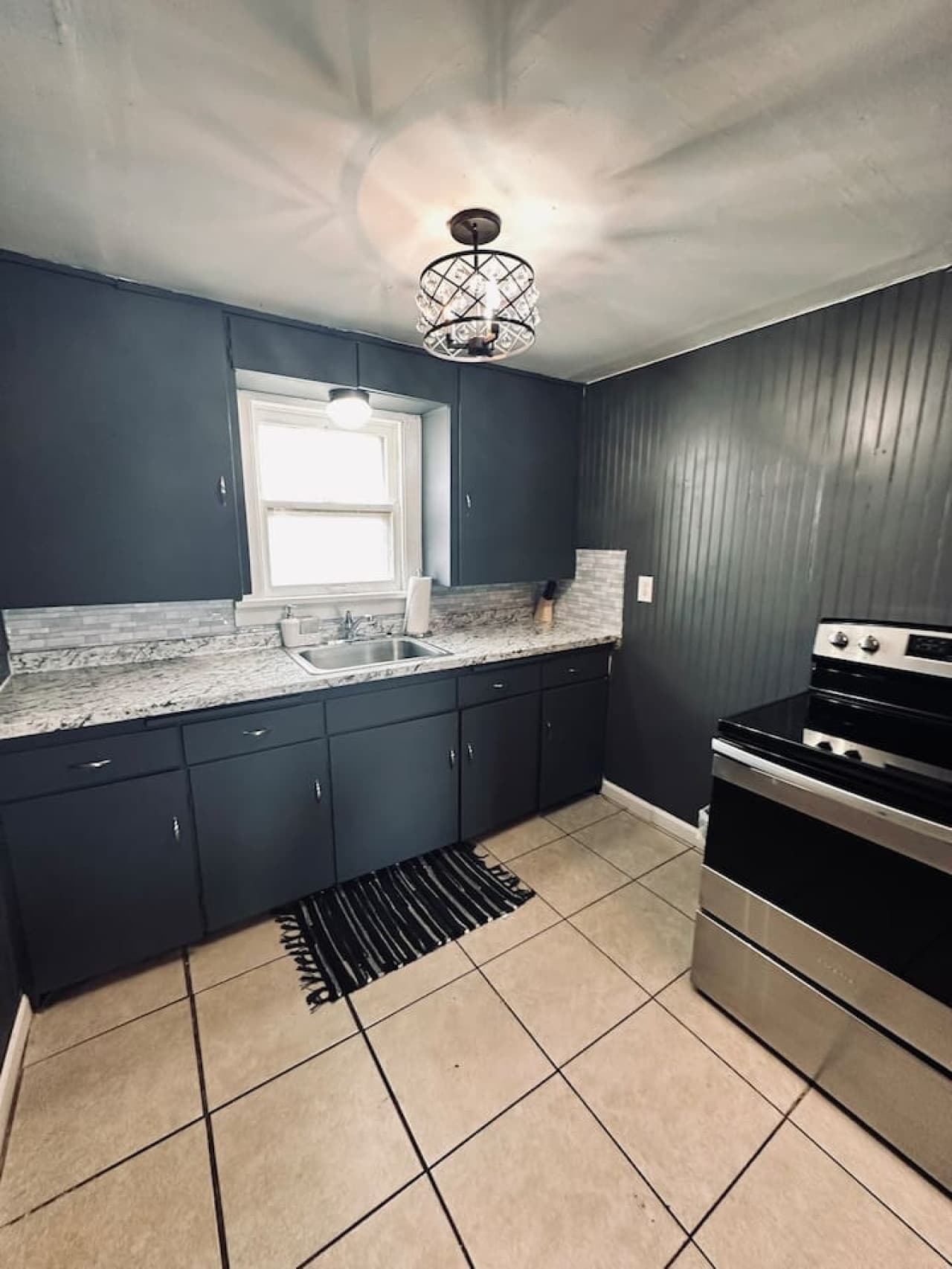 Stainless steel appliances and granite counters in a clean, functional layout.