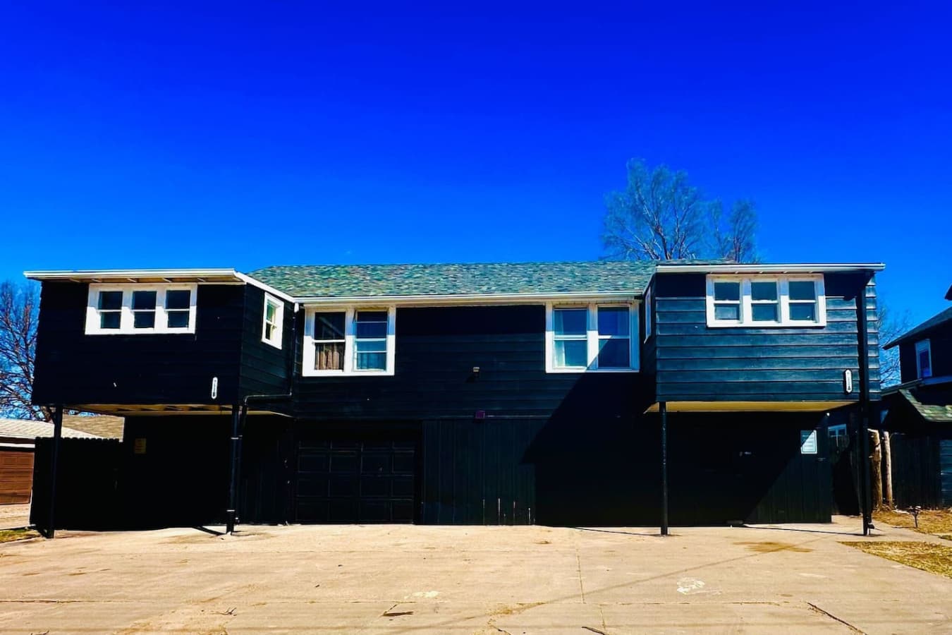 Welcome to your western retreat! This rustic-modern unit sits on the right side of the building when facing it, featuring bold design, cozy cowboy charm, and all the comforts of home. Kick off your boots and unwind at the Midnight Cowboy Getaway.