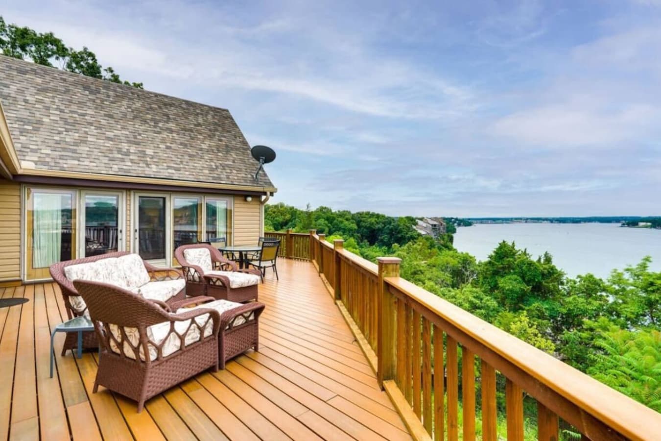 Enjoy the tranquility of the lake from this spacious outdoor deck, ideal for soaking up the views.
