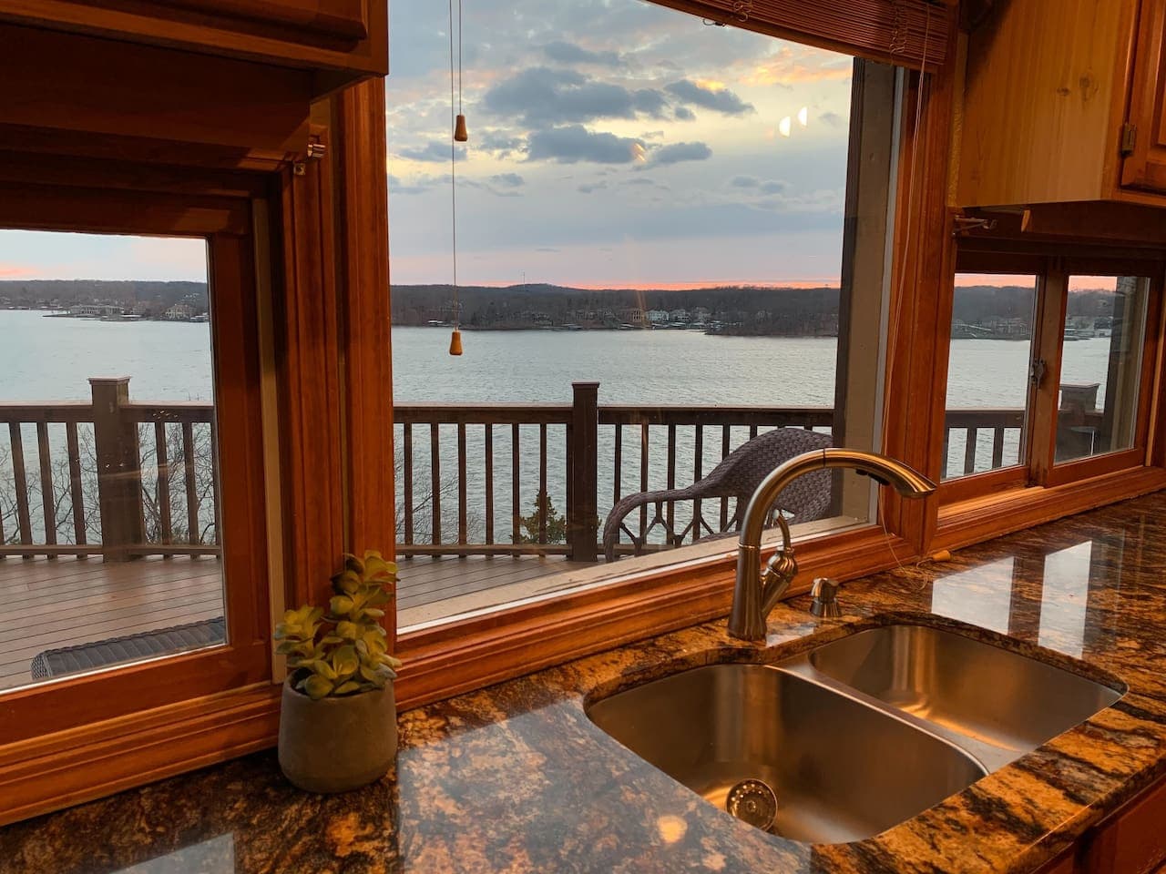 Unwind while enjoying the lake view from the kitchen sink during a spectacular sunset.