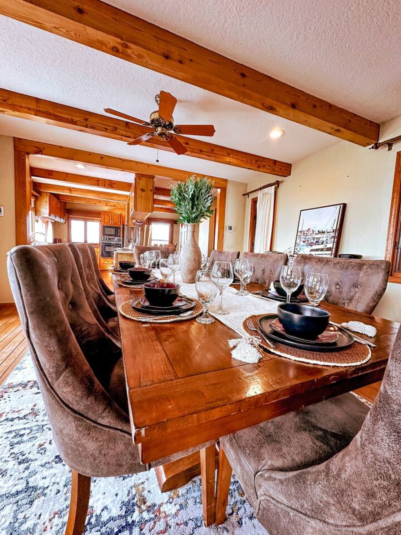 Elegant dining table set and ready for your group, perfect for celebrations or family dinners overlooking the lake.
