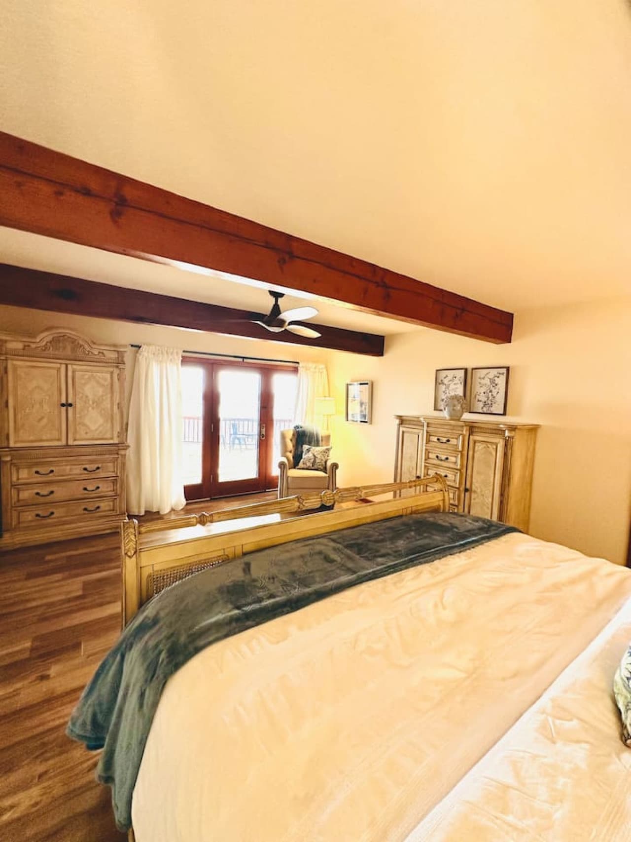 Wake up to serene lake views from the comfort of this beautifully appointed master bedroom.