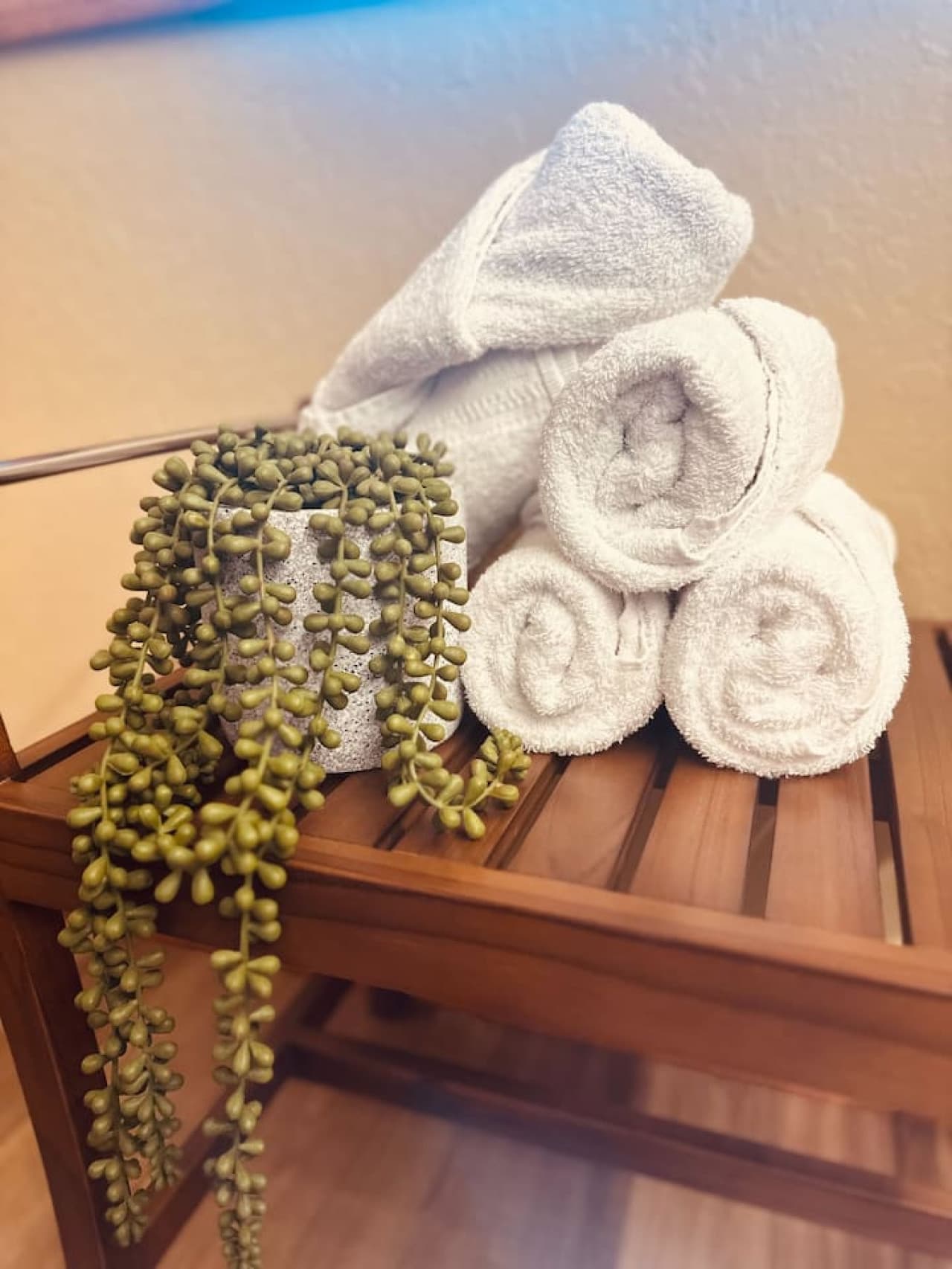 Relax and refresh with luxurious rolled towels and serene decor, adding a spa-like touch to your stay.