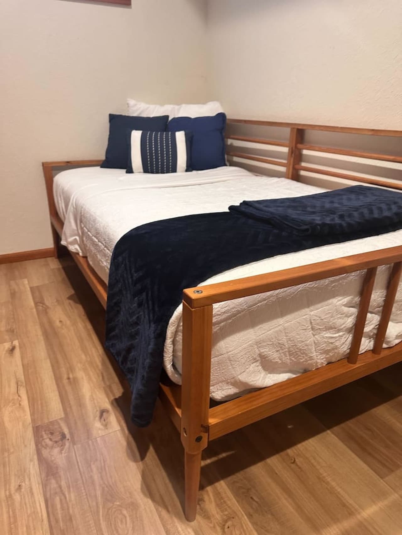 Spare room featuring a comfortable twin bed and ample built-in shelving for added convenience during your stay