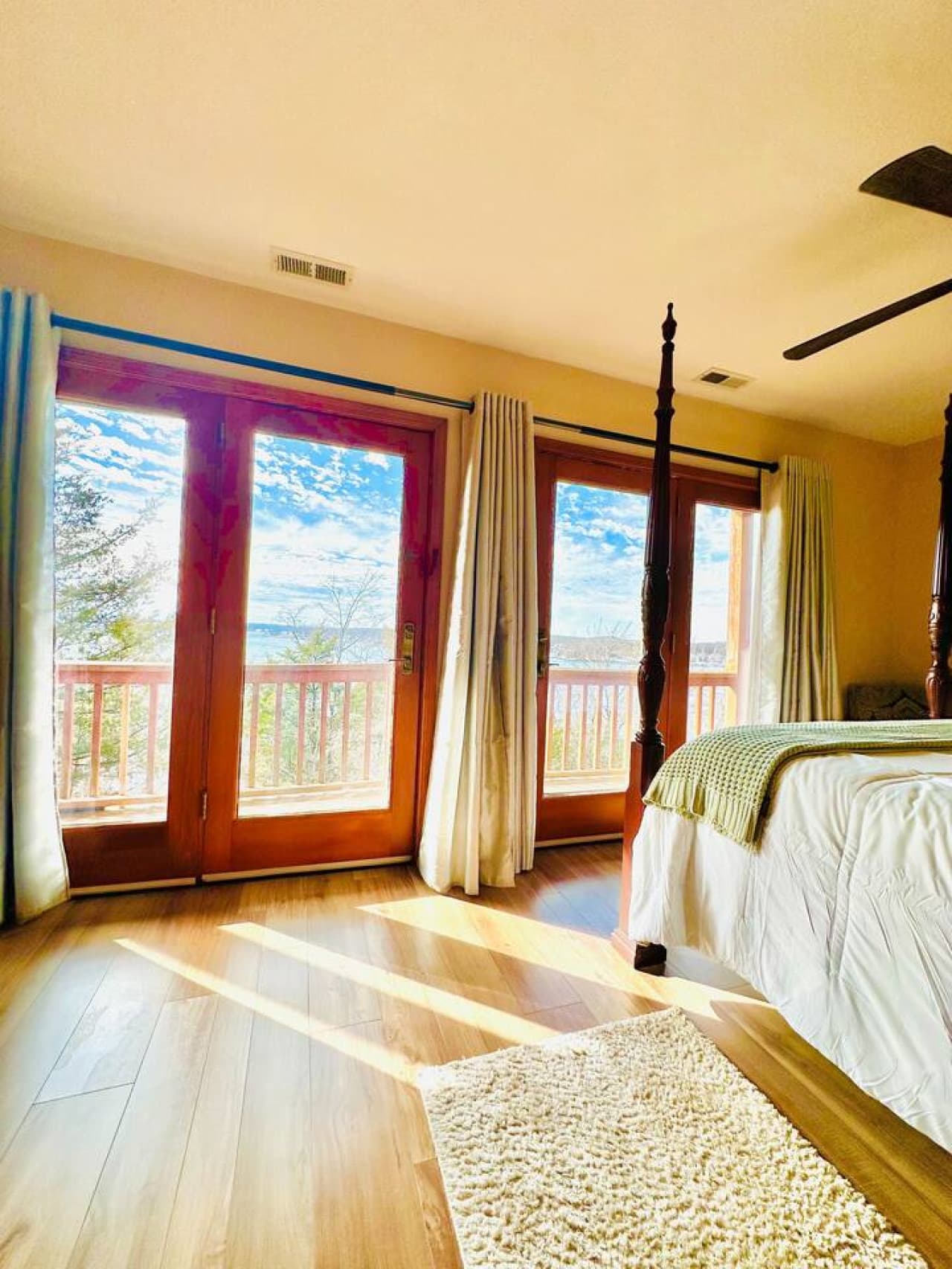 Step out onto the deck from your private queen bedroom and take in the stunning lake views.