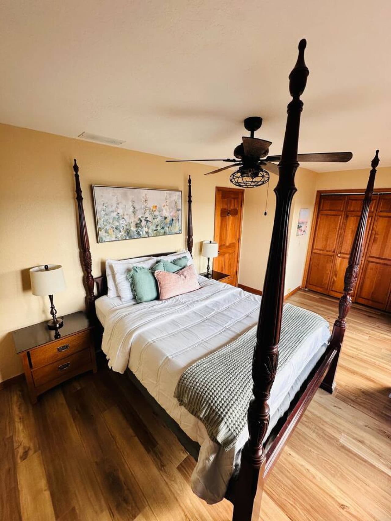 This queen bedroom combines rustic charm with modern comfort, perfect for unwinding after a day at the lake.