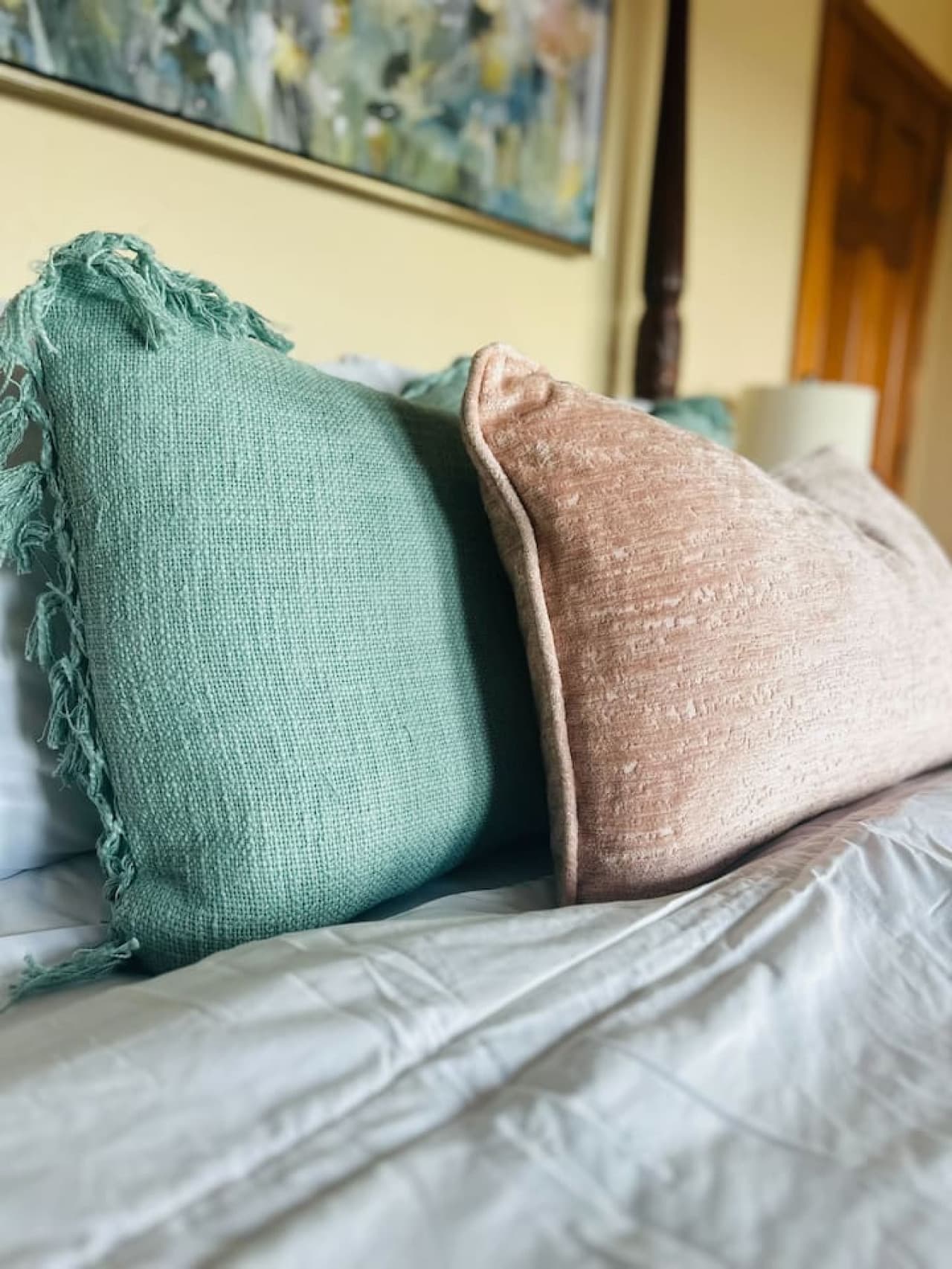 Thoughtful decor, including textured throw pillows and a plush blanket, create a cozy and relaxing retreat.