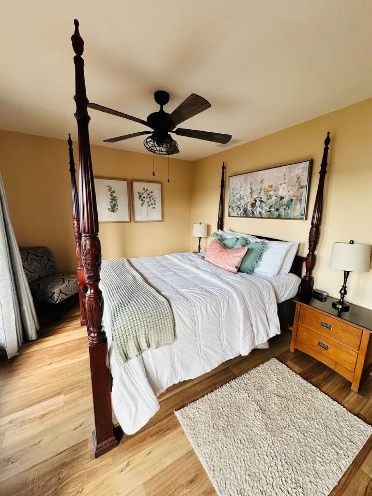 Wake up to natural light streaming through large windows and enjoy direct access to the deck from this serene bedroom.