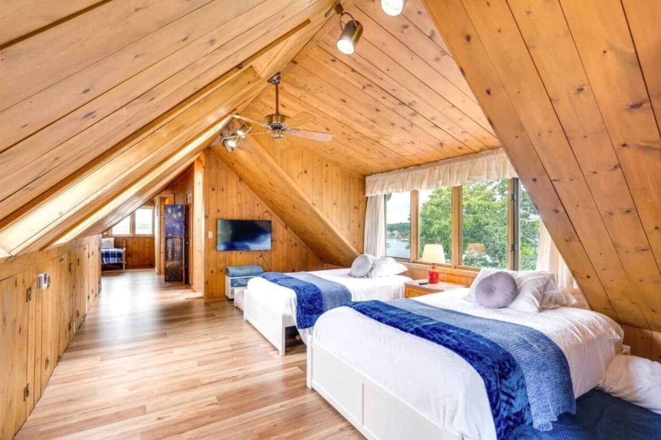This beautifully designed bunk room provides ample sleeping arrangements and a warm, rustic ambiance.