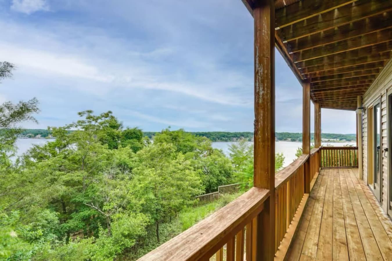 Enjoy stunning lake views and fresh air from the wraparound balcony, perfect for relaxation.