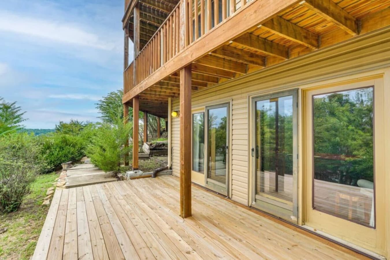 A private deck on the lower level offers a peaceful retreat surrounded by nature.