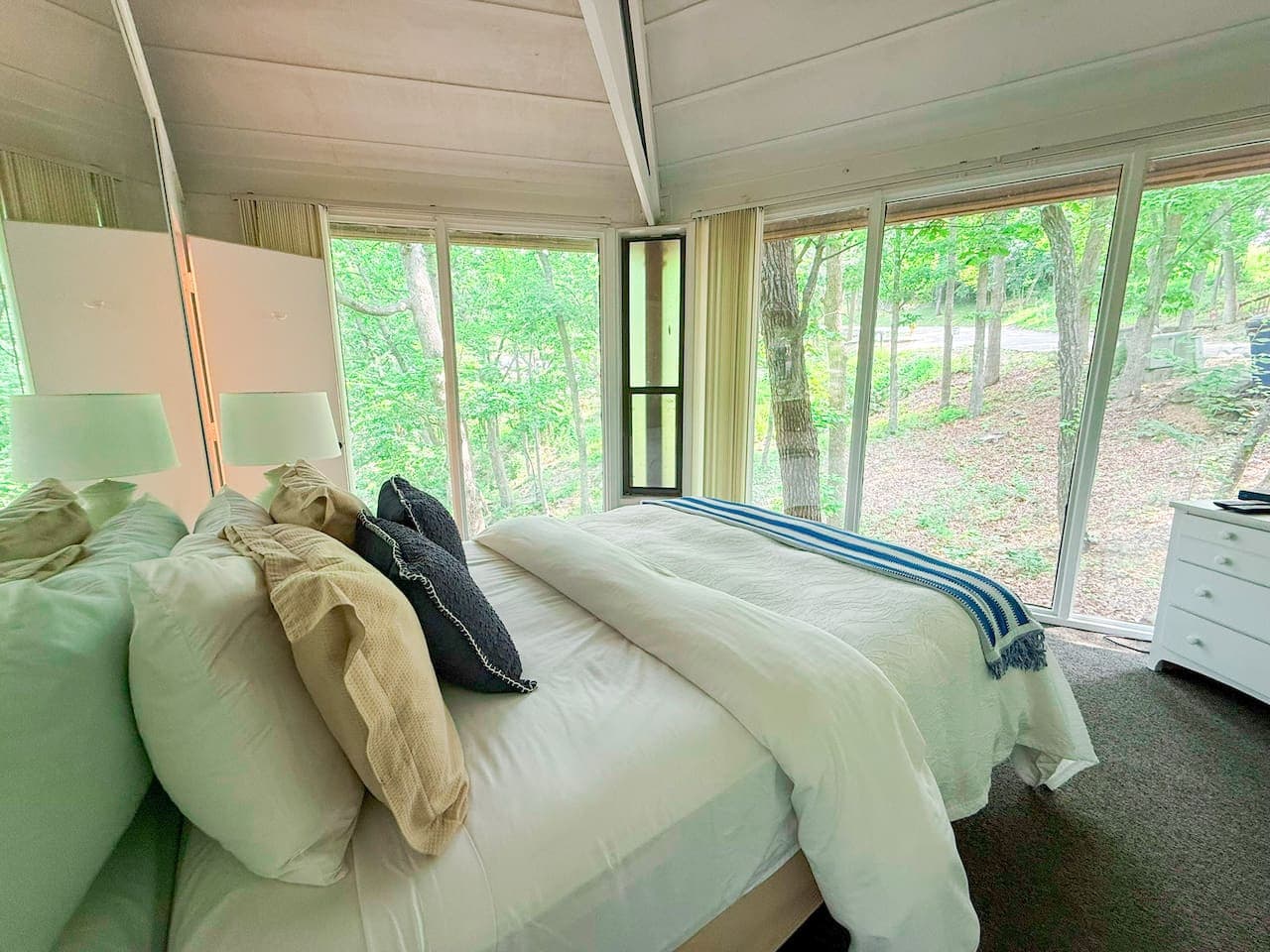Wake up to breathtaking nature views from the comfortable master bedroom, designed to bring the beauty of the outdoors inside