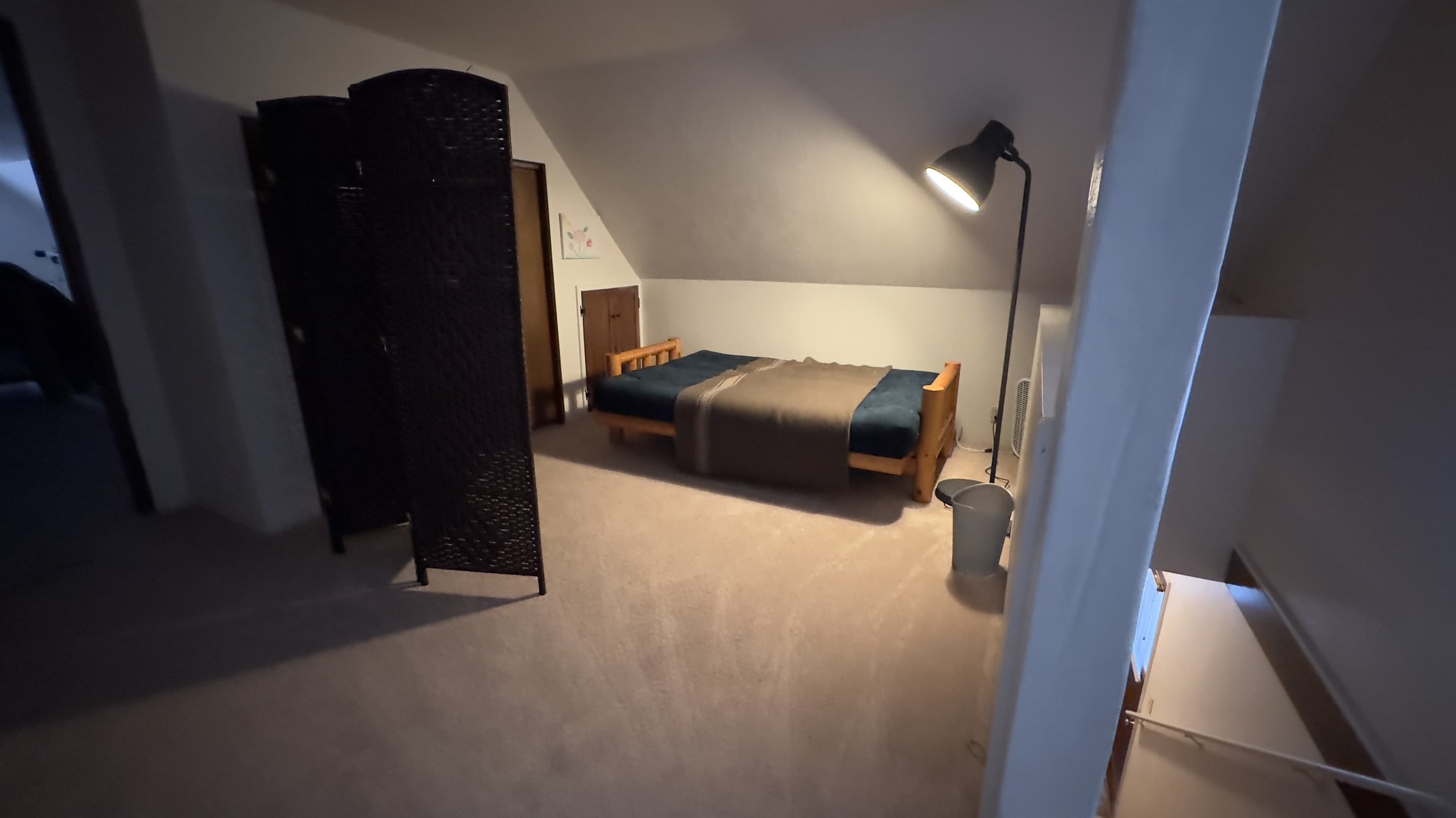 Futon bed at top of stairs