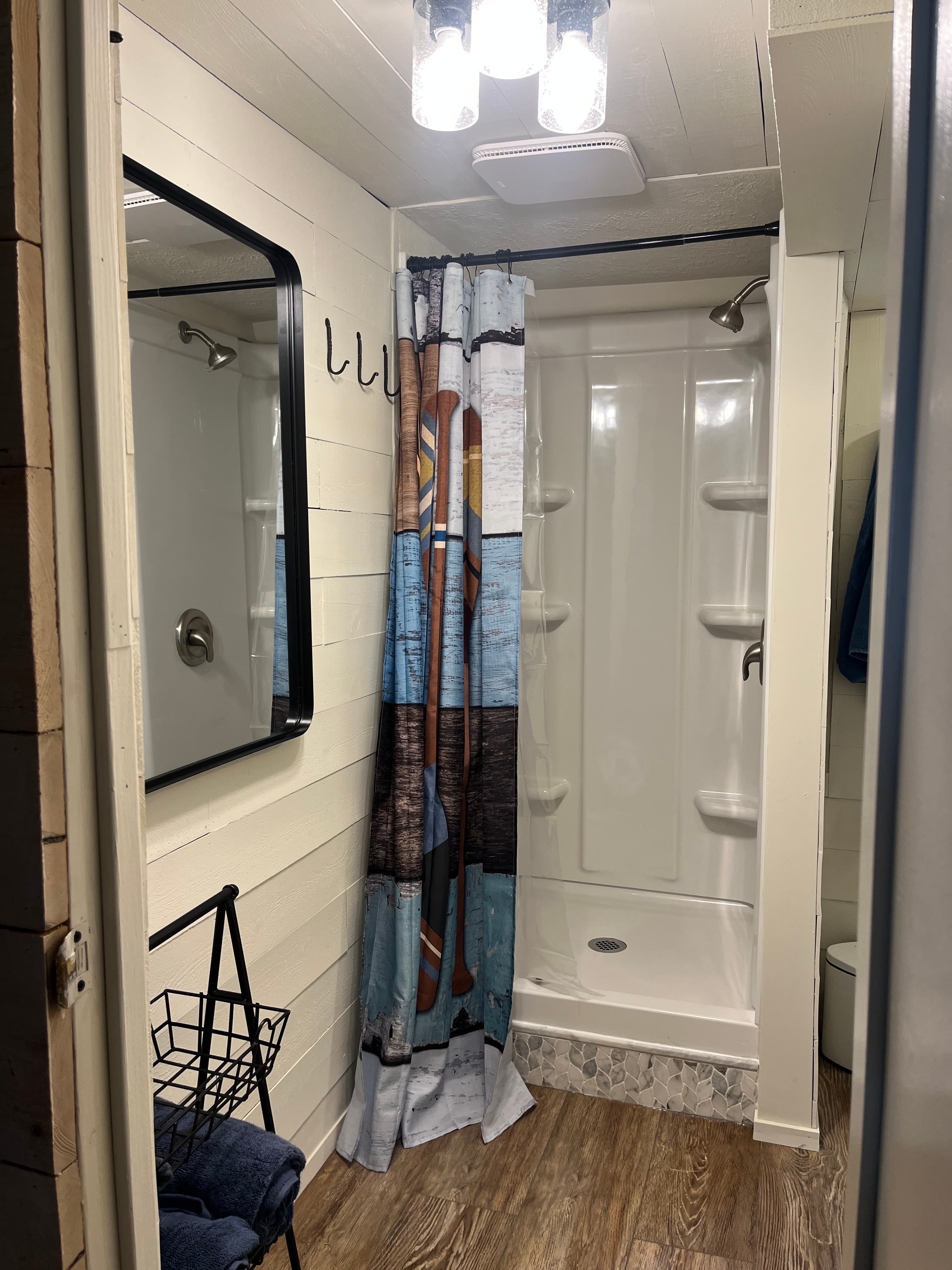 Brand new bathroom with shower and towels 