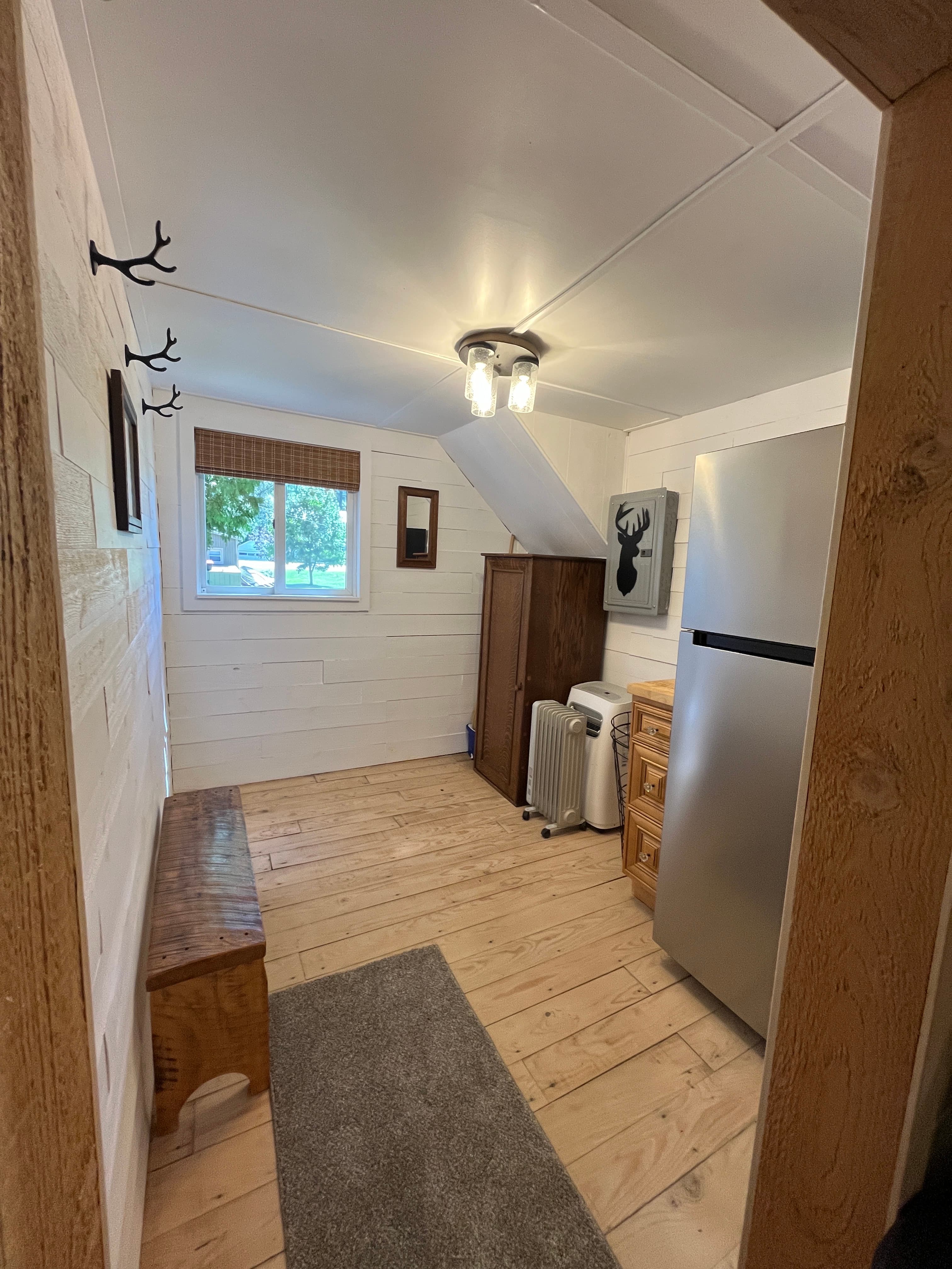 Brand new refrigerator in our mud room with room for your cooler.