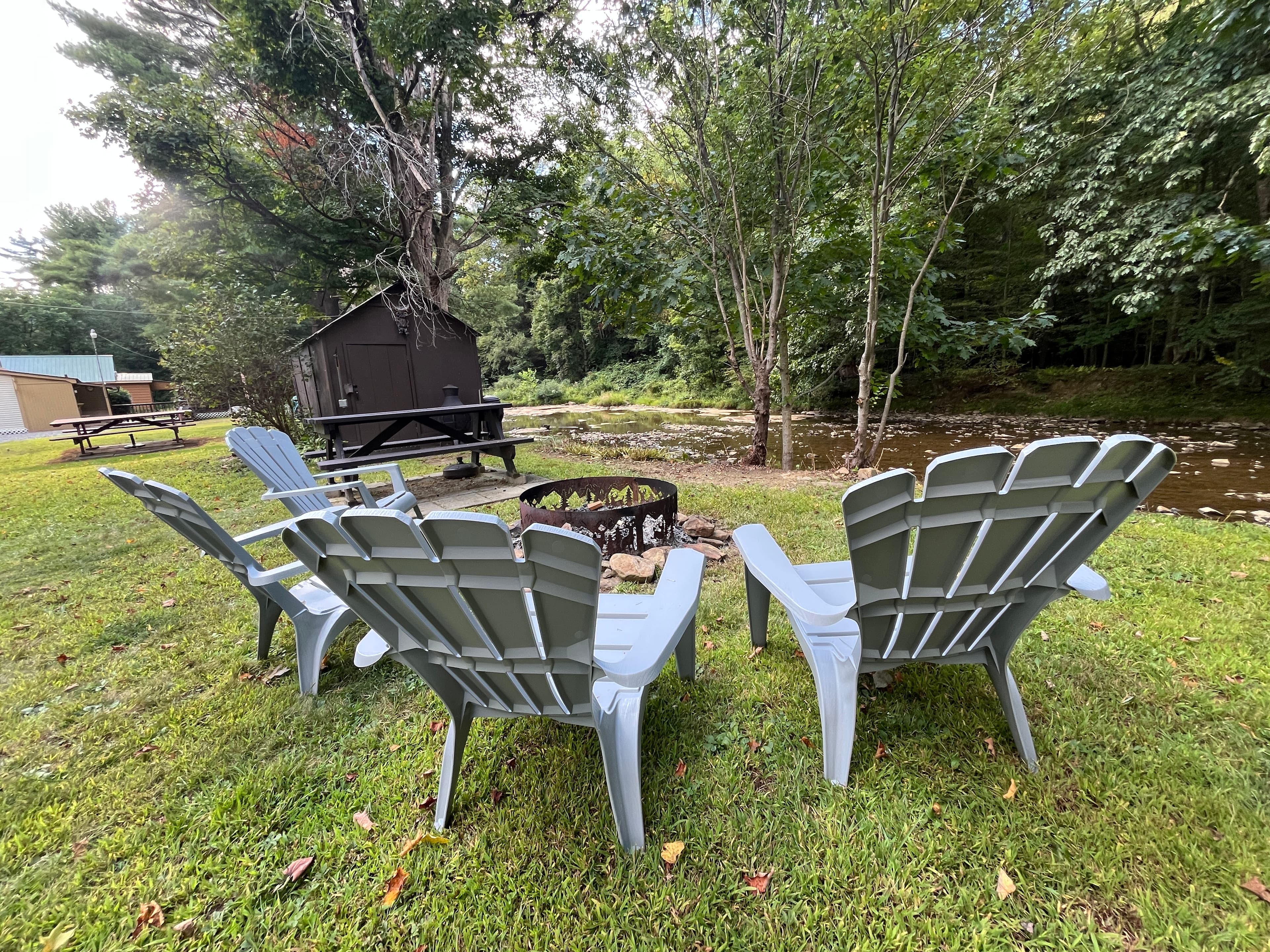 View from the fire pit-6 chairs and picnic table for outside dining. Full set of plastic dishware. 