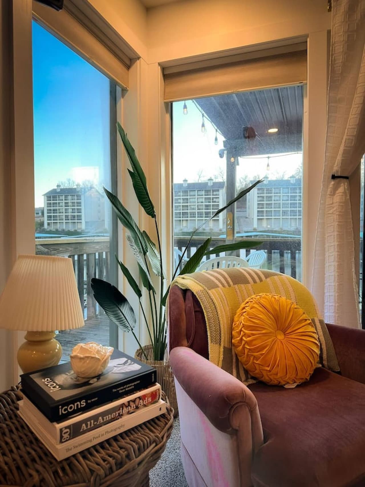 Cozy up in this serene corner flooded with natural light and thoughtful decor.