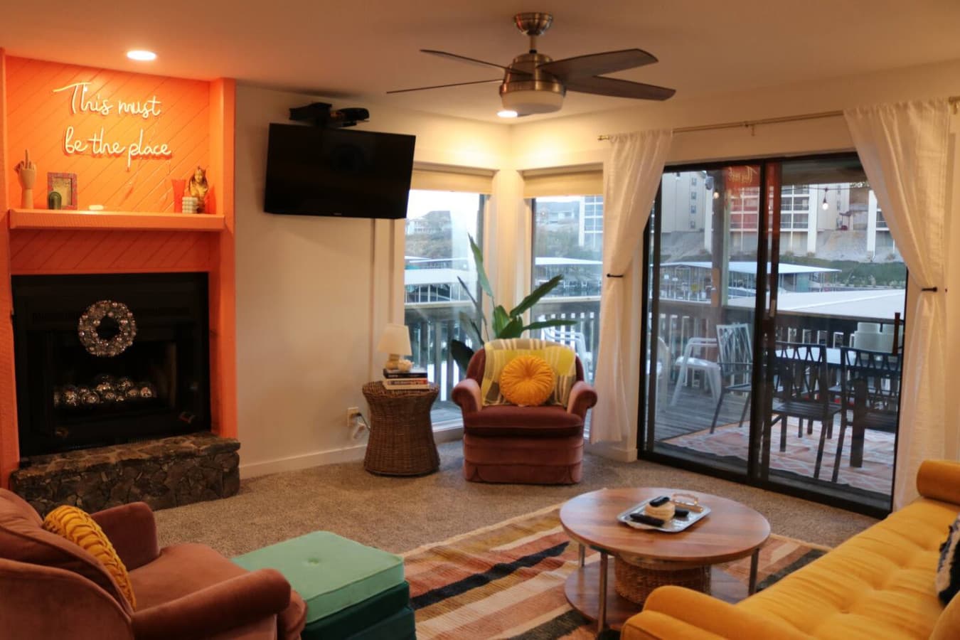 Curl up by the fireplace and enjoy the warm ambiance of this thoughtfully designed living room.