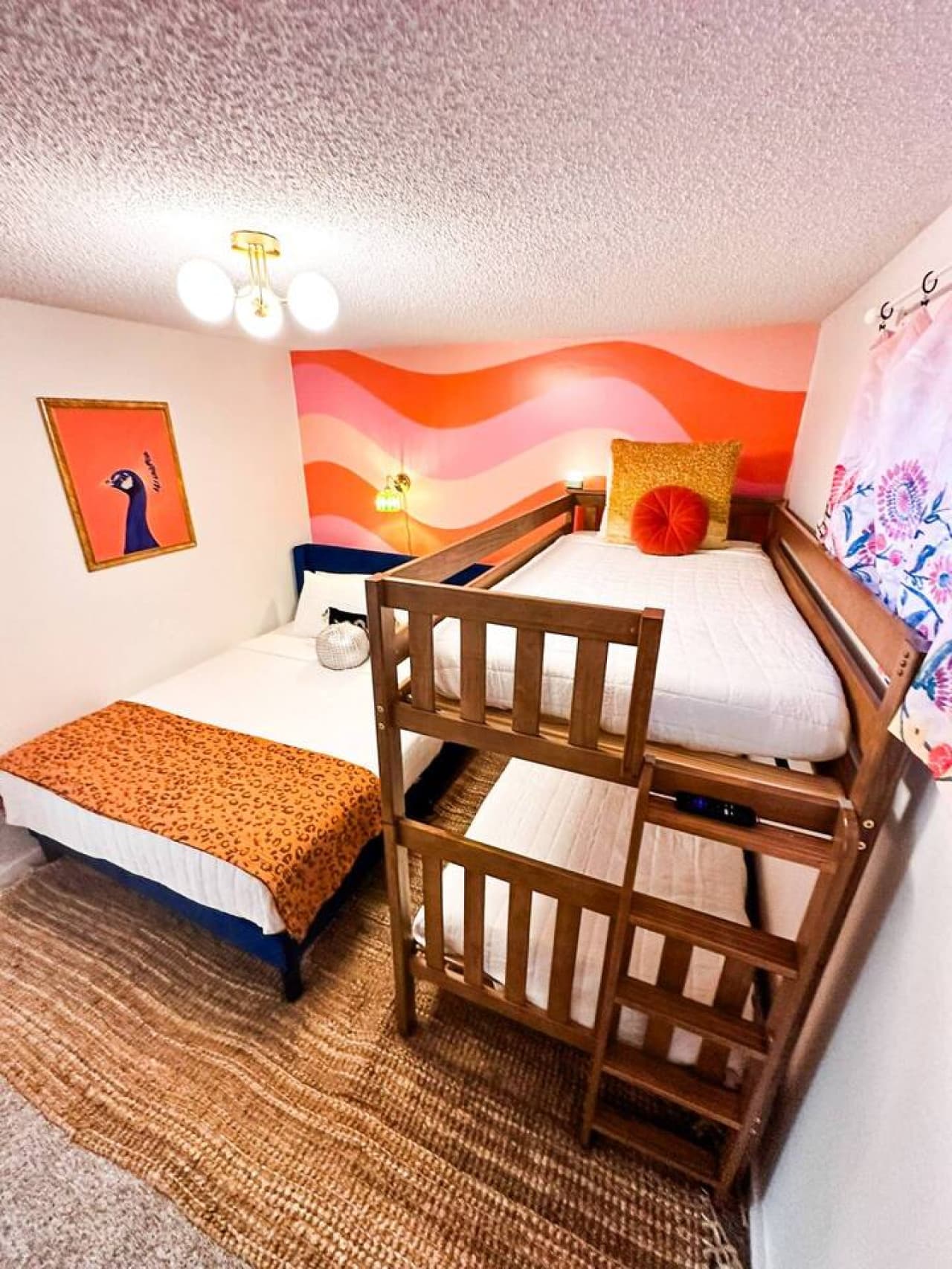 Playful and practical – this bright room is perfect for family stays with twin bunk beds, queen bed and chic design.
