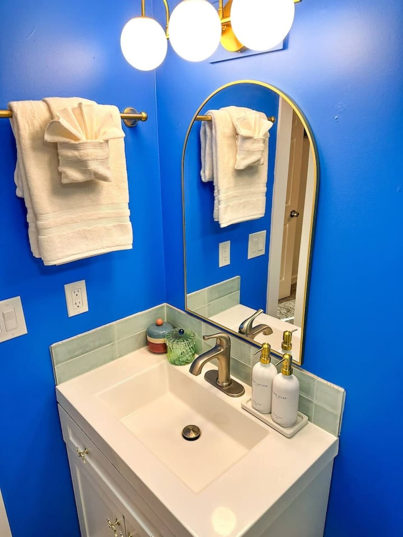 Relax in a refreshing bathroom designed with clean lines, bold colors, and every detail in mind.